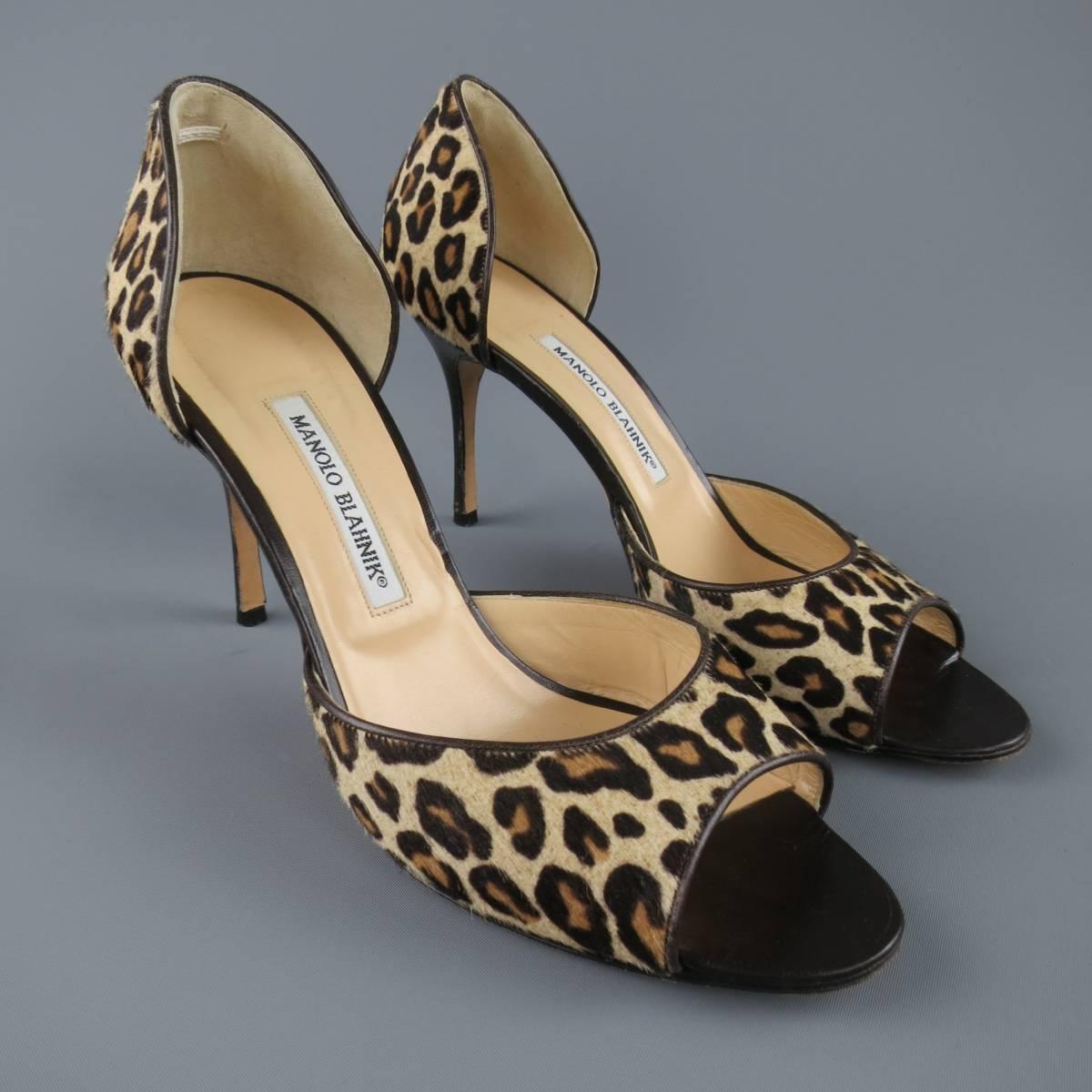 These MANOLO BLAHNIK pumps come in a leopard cheethah print with brown leather piping and features a peep toe, stacked stiletto heel,  and D'orsay style. Made in Italy.
 
Good Pre-Owned Condition.
Marked: IT 40.5
 
Heel: 3.75 in.


Web ID: 82243 
