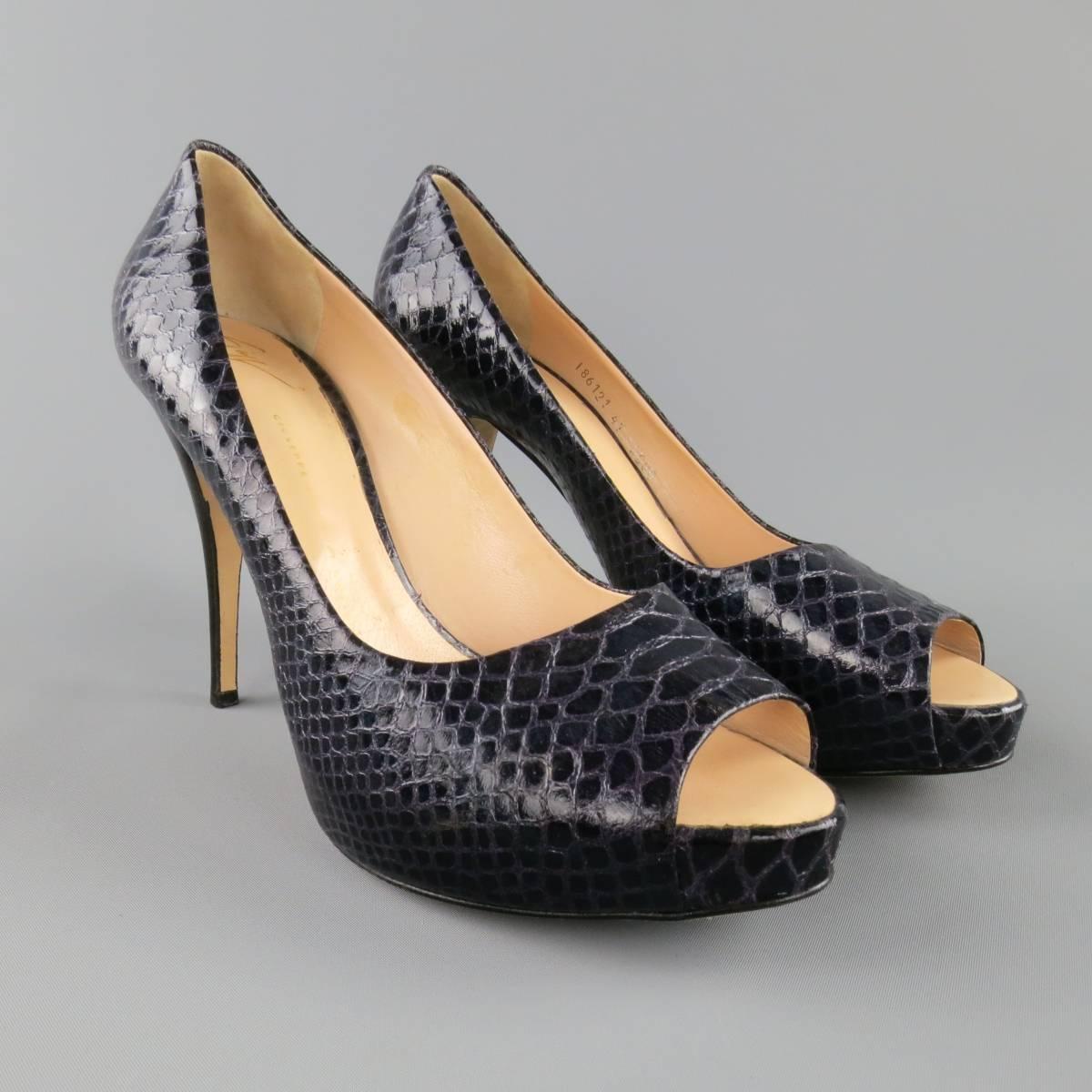 GIUSEPPE ZANOTTI pumps come in a deep violet purple snakeskin leather and feature a peep toe, concealed platform, and stacked stiletto heel. Made in Italy.
 
Excellent Pre-Owned Condition.
Marked: IT 41
 
Heel: 4.75 in.
Platform: 1 in.


Web ID: