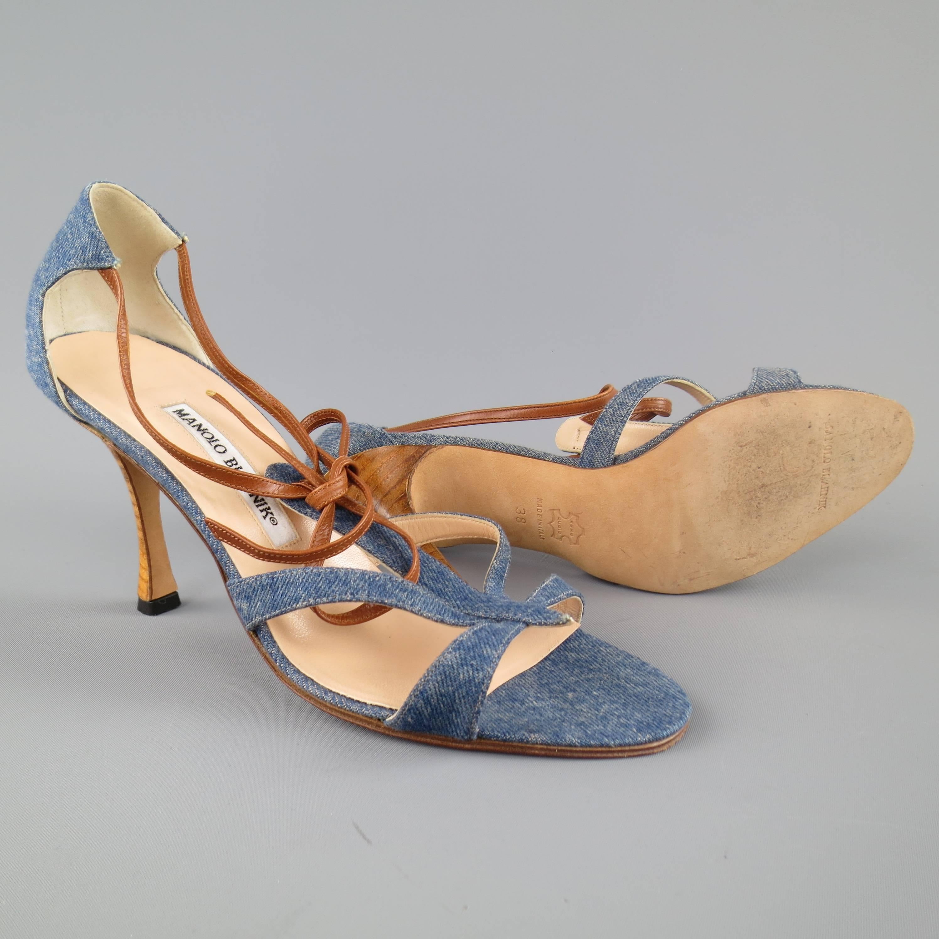 MANOLO BLAHNIK sandals in blue denim features a strappy front with tan leather bow accent. Made in Italy.
 
Good Pre-Owned Condition.
Marked: IT 38
 
Heel: 3.5 in.


Web ID: 82512 