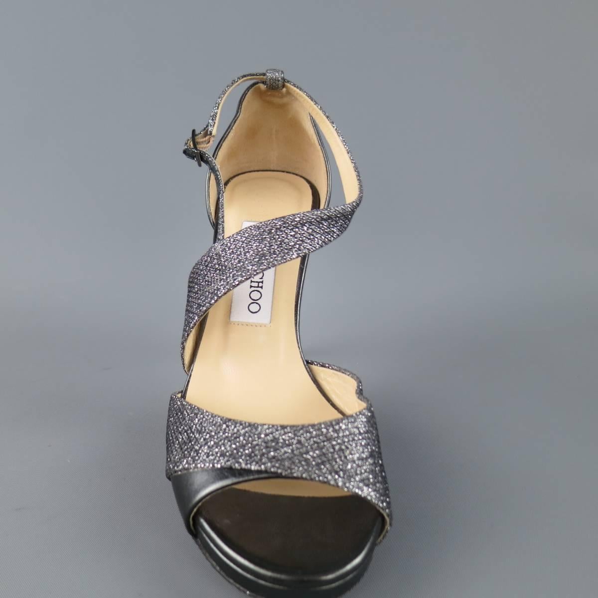 JIMMY CHOO "Tyne" sandals come in anthracite metallic leathr and feature a diagonal metallic fabric strap and metallic heel. Imperfection on right heel. As-Is. Made in Italy.
 
Good Pre-Owned Condition.
Marked: IT 36
 
Heel: 4