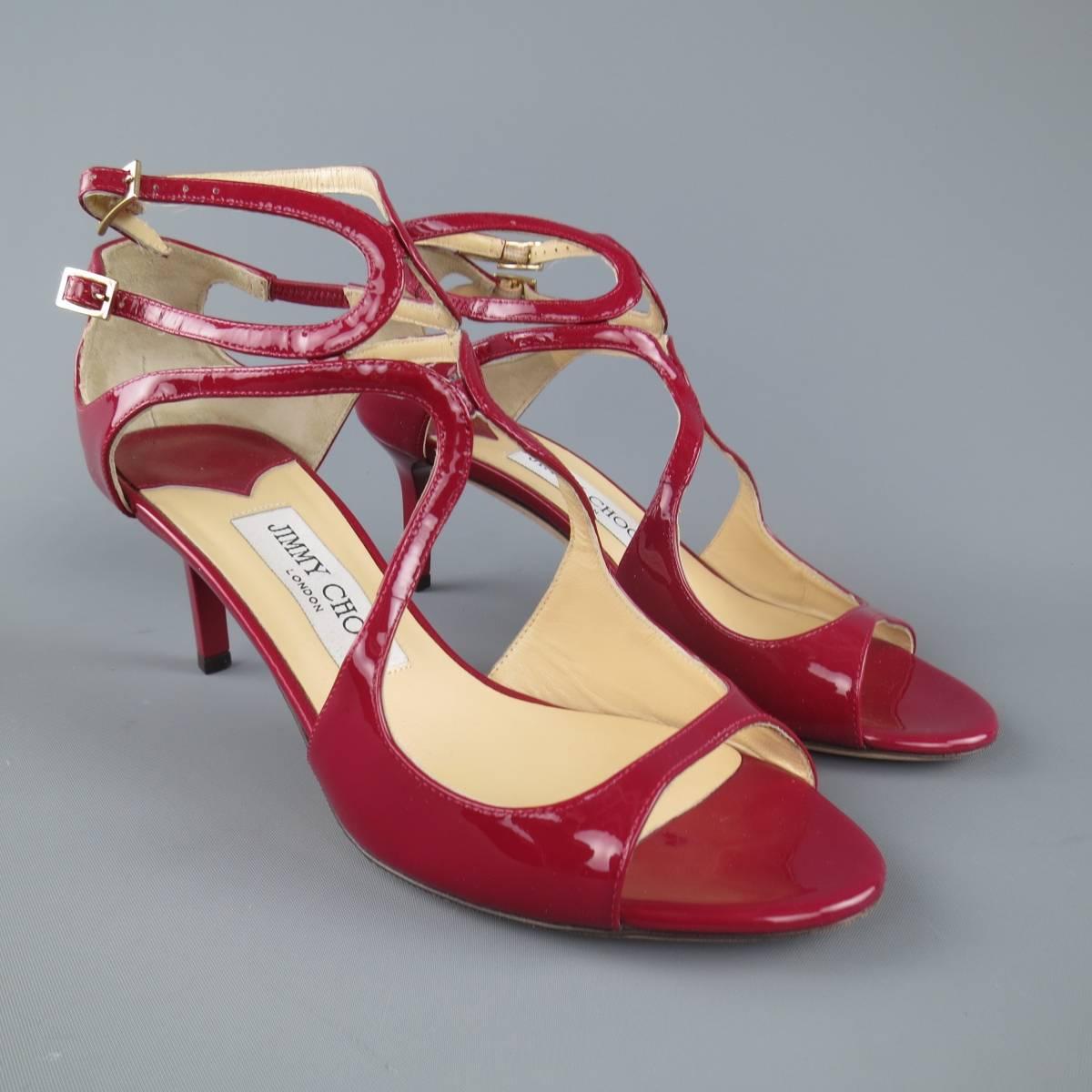 JIMMY CHOO "Lang" sandals come in a dark red patent leather and feature symmetrical curved straps. Made in Italy.
 
Excellent Pre-Owned Condition.
Marked: IT 36
 
Heel: 2.5 in.


Web ID: 80849 