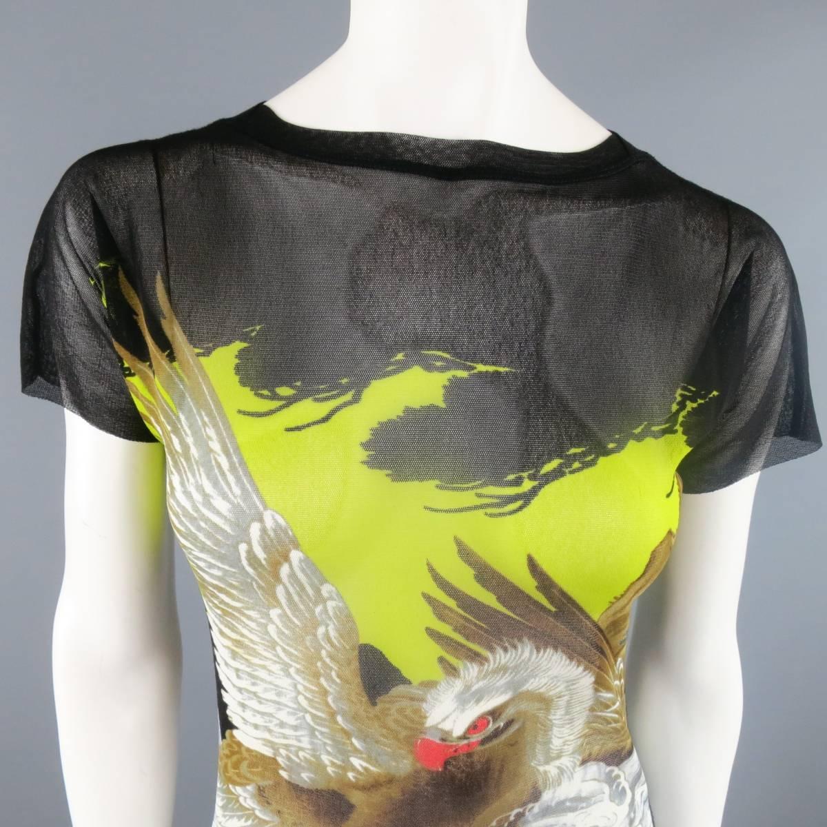 Vintage JEAN PAUL GAULTIER polyamide see-through mesh t-shirt features a generous stretch around the body, black and green multi-colored Japanese eagle on waves air brush design, and aw edging on sleeves with exposed seams on the sides and bottom