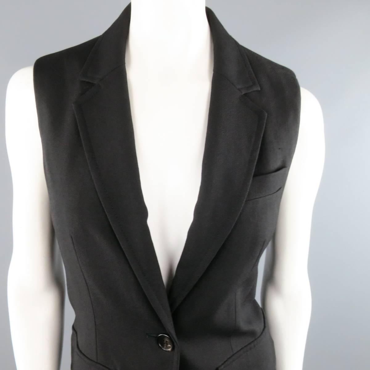 PHILLIP LIM sleeveless sport coat style vest in a virgin wool bend twill featuring a notch lapel, single button closure, and double patch flap pockets.
 
Good Pre-Owned Condition.
Marked: 6
 
Measurements:
 
Shoulder: 14 in.
Bust: 37 in.
Length: 28