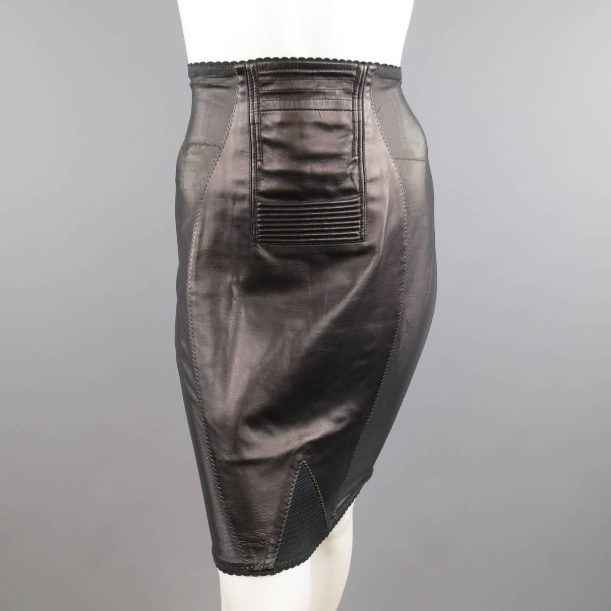 Fabulous vintage JEAN PAUL GAULTIER pencil skirt designed in the style of a retro lingerie girdle features a detailed leather center, triangular stretch panel, and see-through stretch micro-mesh side panels. Minor wear throughout. Made in Italy.
