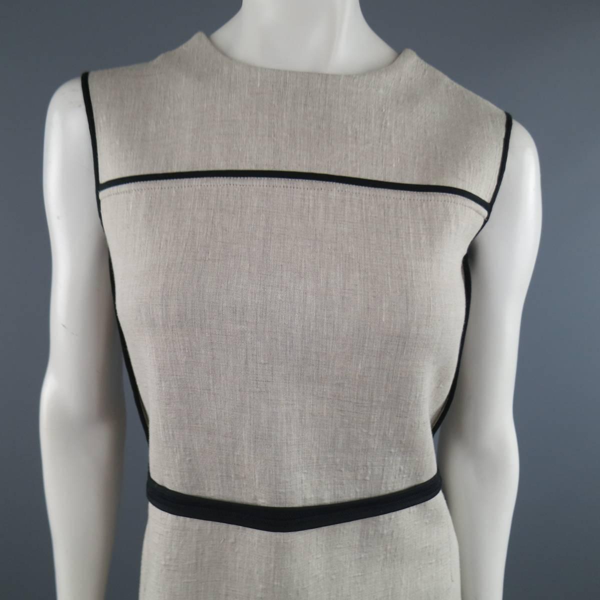 Sleeveless MARNI A line shift dress comes in a khaki beige bonded linen over wol and features a high neckline, black piping, and reverse finished seams throughout. Texture throughout. Made in Italy.
 
Excellent Pre-Owned Condition.
Marked: IT 38
