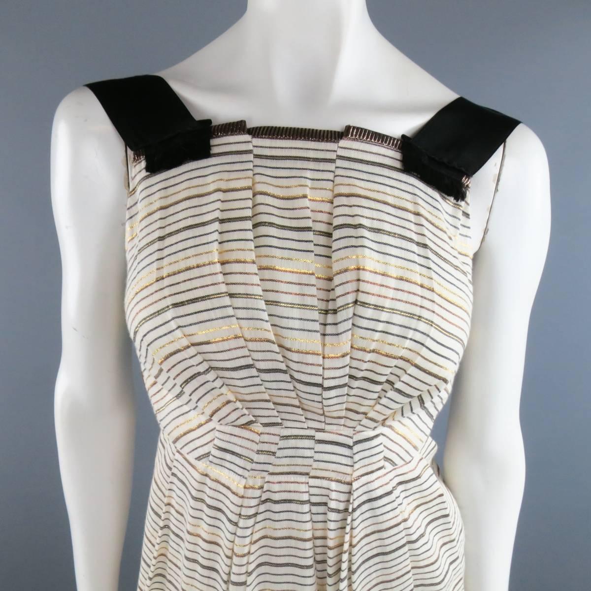 MARC JACOBS dress in a light cream khaki linen with metallic gold, navy, and brown stripes and features thick black ribbon straps, pleating details throughout, and asymmetrical back. Made in USA.
 
Excellent Pre-Owned Condition.
Marked: 2
