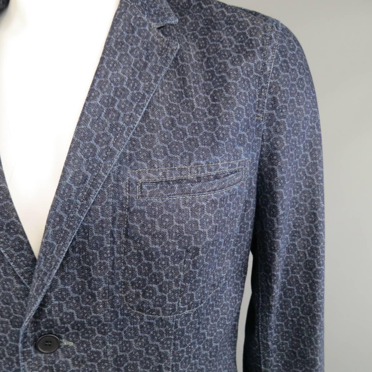 BOTTEGA VENETA sport coat in a navy indigo blue printed denim with a two button closure, notch lapel and slit pockets. Made in Italy.
 
Excellent Pre-Owned Condition. Retails at $1995.00.
Marked: 54
 
Measurements:
 
Shoulder: 17.5 in.
Chest: 46