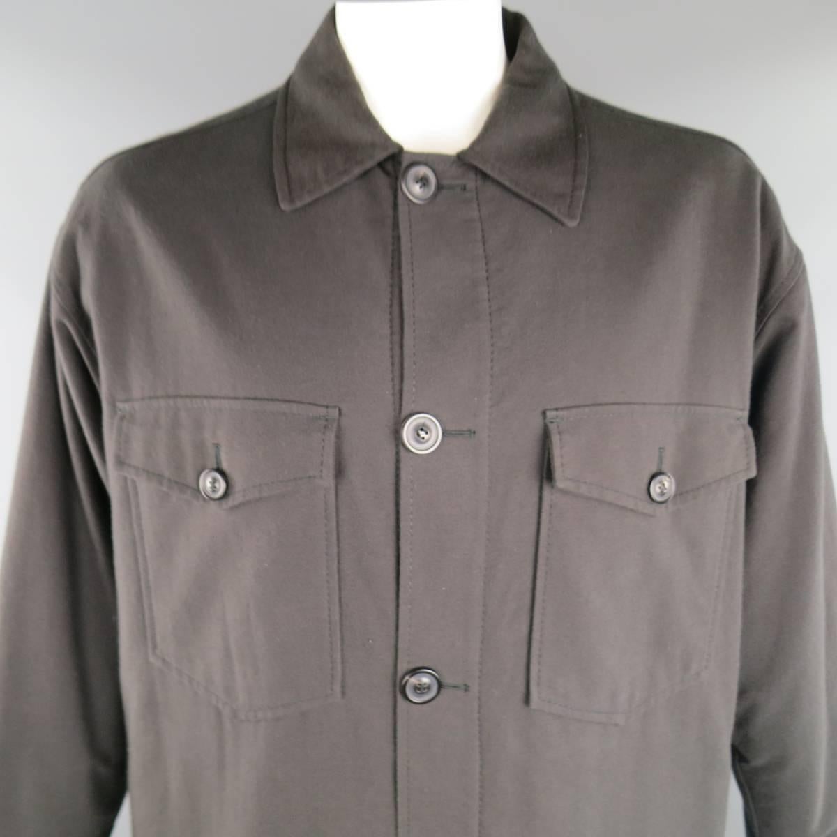 MAISON MARTIN MARGIELA oversized shirt jacket comes in a cotton wool blend flannel twill and features a classic pointed collar, patch flap pockets, sit hem, and button up front. Made in Italy.
 
Excellent Pre-Owned Condition. Retails at