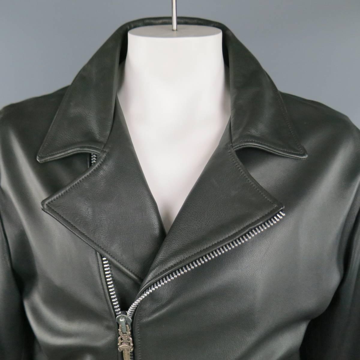 One of a kind, custom CHROME HEARTS motorcycle jacket in black leather featuring a pointed collar, zip front, slanted zip pockets and zip cuffs, all with signature sterling silver engraved sward tabs, lace up sides with sterling silver hardware, and