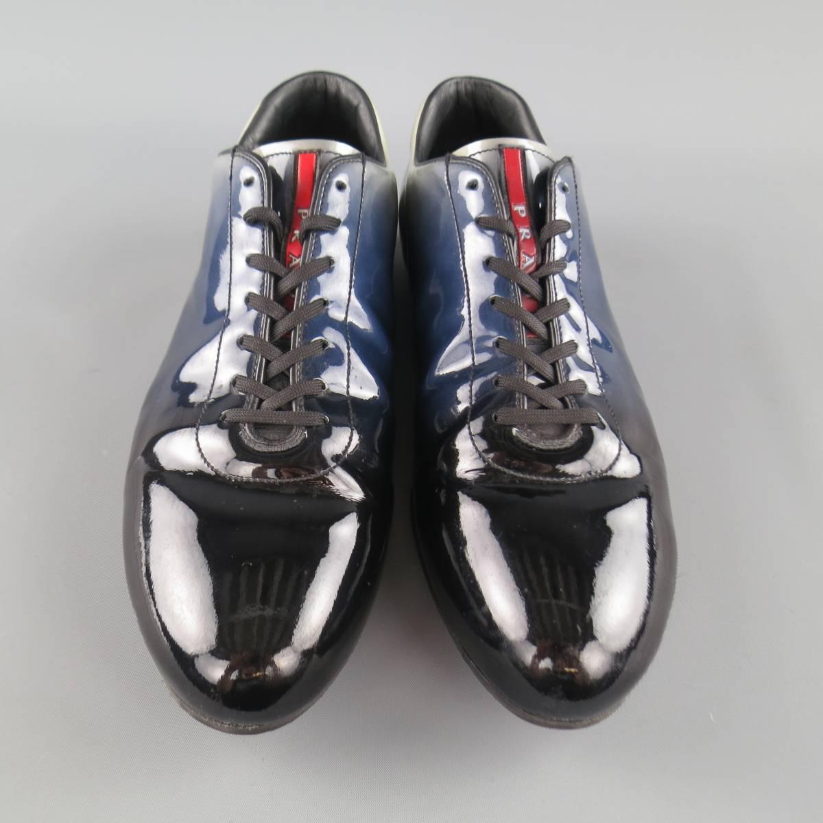 PRADA sneaker dress shoes come in a high shine patent leather with a black to blue to light gray ombre gradient effect and rubber sole.  Scruffs throughout. As-Is. Made in Italy.
 
Good Pre-Owned Condition.
Marked: UK 9
 
Outsole: 12 x 4 in.
 


Web