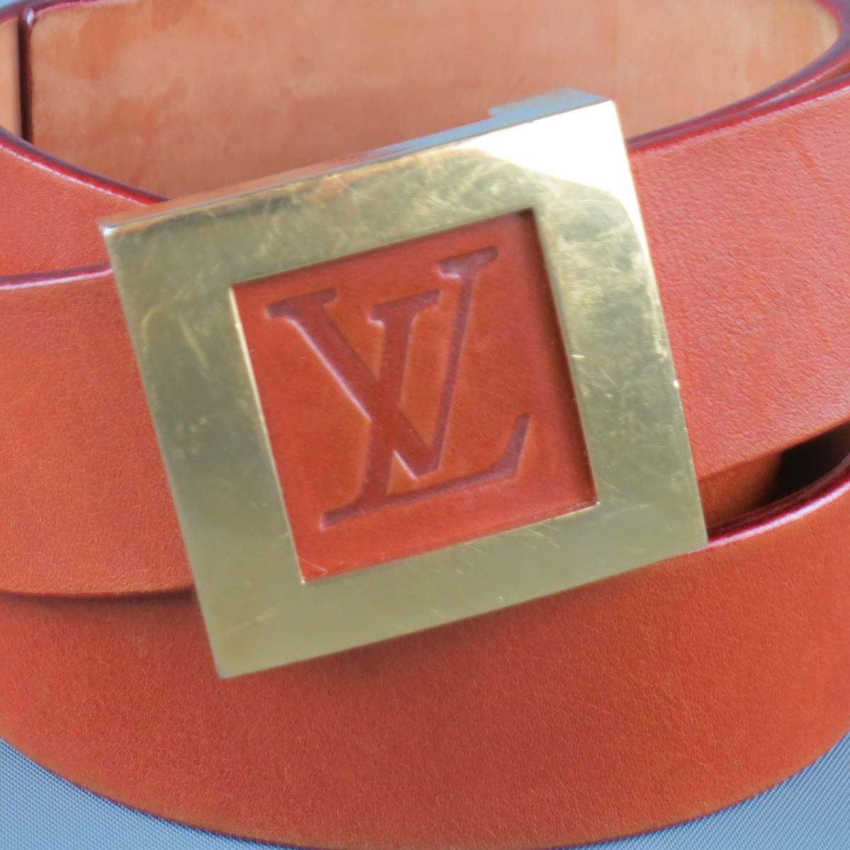 LOUIS VUITTON belt features a tan leather strap with gold tone brass square shaped buckle framing a LV embossed logo. Wear throughout. Made in France.
 
Fair Pre-Owned Condition.
Marked: 90/36
 
Length: 42 in.
Width: 3 cm.
Fits: 34-38 in.
Buckle: