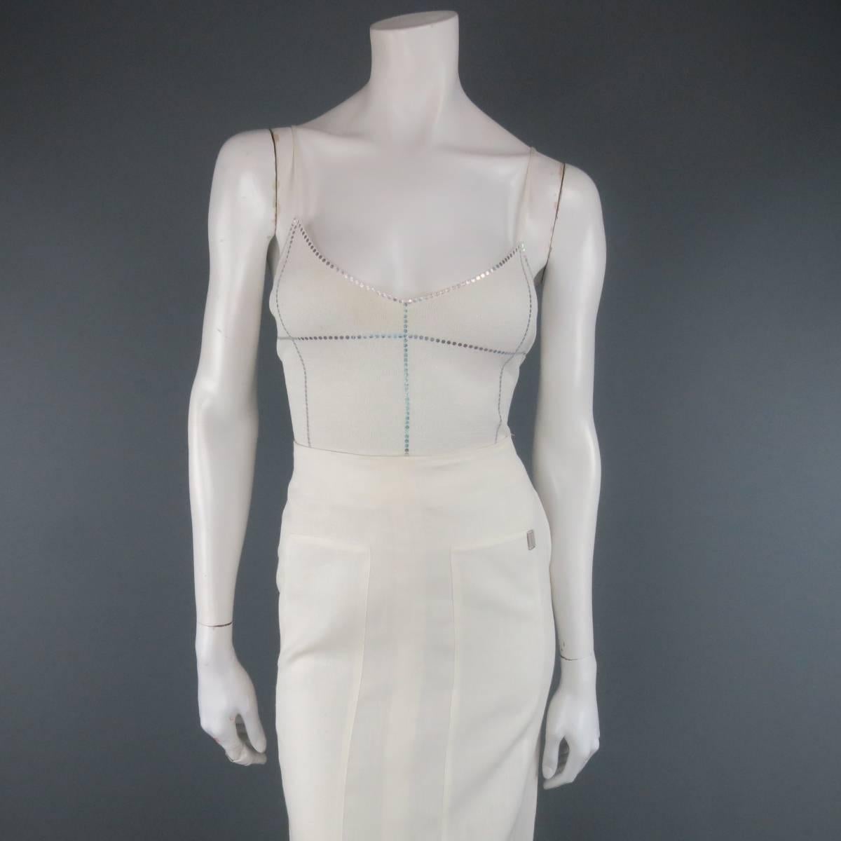 This fabulous CHANEL 1999 two piece ensemble includes a cropped lurex sparkle knit camisole iridescent metallic holographic spot trim, and matching linen like sheer ramie  maxi skirt.  Discoloration at neckline of camisole. As-Is. Made in France.
