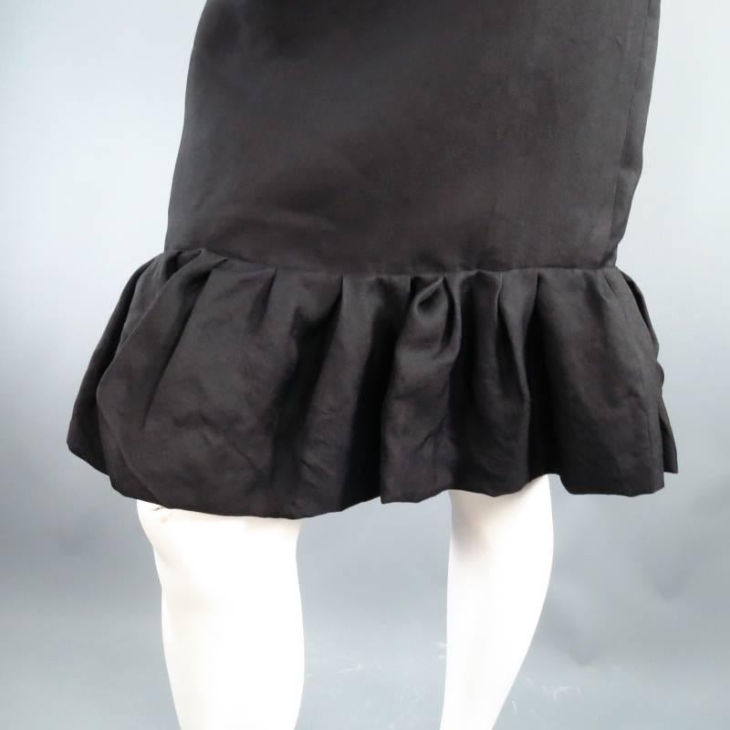 Lovely black silk pencil skirt by LANVIN. This style comes in a semi matte textured fabric and features a raw edge waist line with darts and pleated ruffle hem. Circa 2006. Made in France.
 
Excellent Pre-Owned Condition.	Tag Size: 38	Fits Like: US