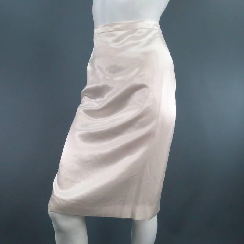 Lovely cream silk blend pencil skirt. A classic style in glossy satin featuring a thin waist band, back slit. and hidden zip and button closure. Circa 2006. Made in France.
 
Excellent Pre-Owned Condition. Tag Size: 40	Fits Like: US 8
 
Waist: 31