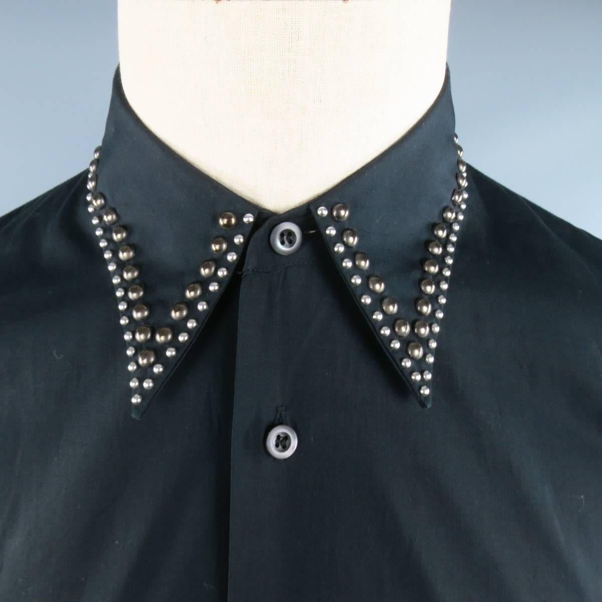 PRADA Fall Winter 2009 Collection shirt comes in black cotton and featuring a pointed collar with silver and copper tone studded trim. Made in Italy.
 
Good Pre-Owned Condition.
Marked: 39 / 15 1/2
 
Measurements:
 
Shoulder: 17 in.
Chest: 42