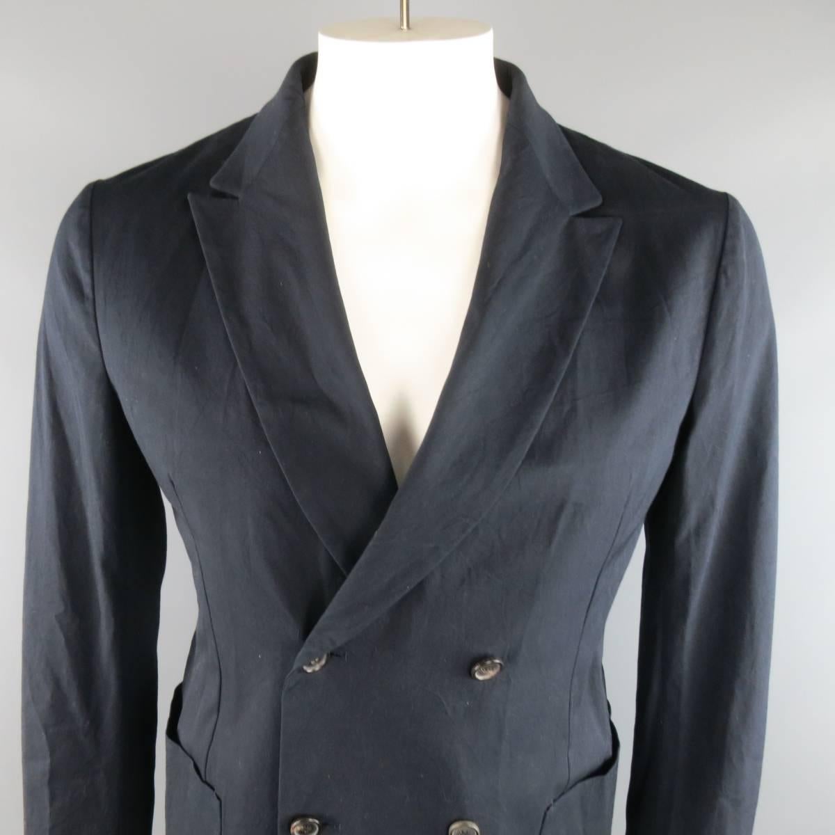 JIL SANDER double breasted sport coat comes in a casual weight navy blue cotton and features a peak lapel, double patch pockets, and a stretch polyamide knit back panel. Made in Italy.
 
New with Tags. Retails at $1495.00.
Marked: IT 52
