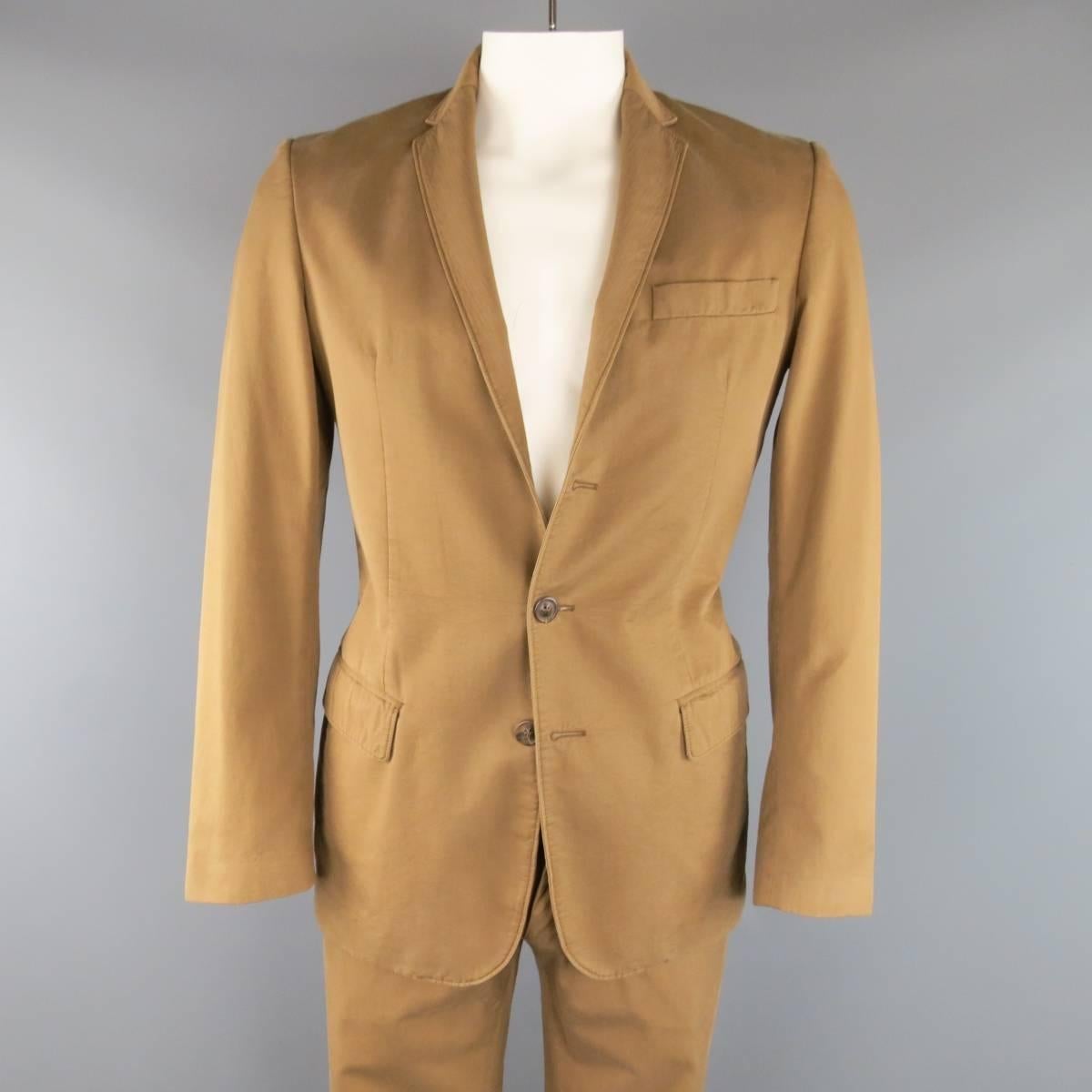 MAISON MARTIN MARGIELA casual suit comes in a light tan brown cotton chino twill and includes a two button, notch lapel sport coat with functional button cuffs, and matching flat front pants. Minor wear throughout. Made in Italy.
 
Good Pre-Owned