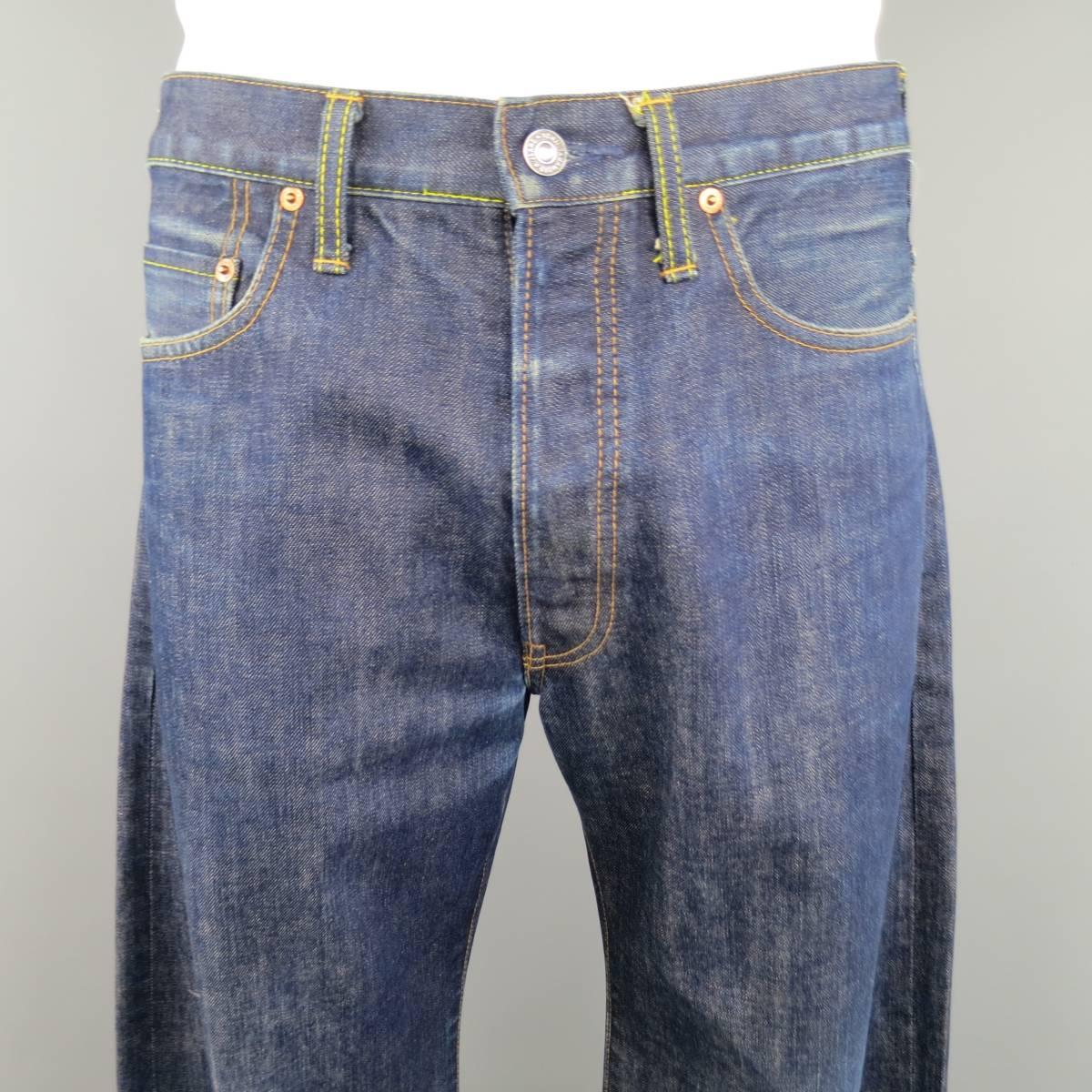Vintage YOHJI YAMAMOTO jean come in an indigo navy blue selvedge denim and feature a button fly, wide leg, and tan patent back patch. Wear throughout. As-Is. Made in Japan.
 
Good Pre-Owned Condition.
Marked: 34
 
Measurements:
 
Waist: 34 in.
Rise: