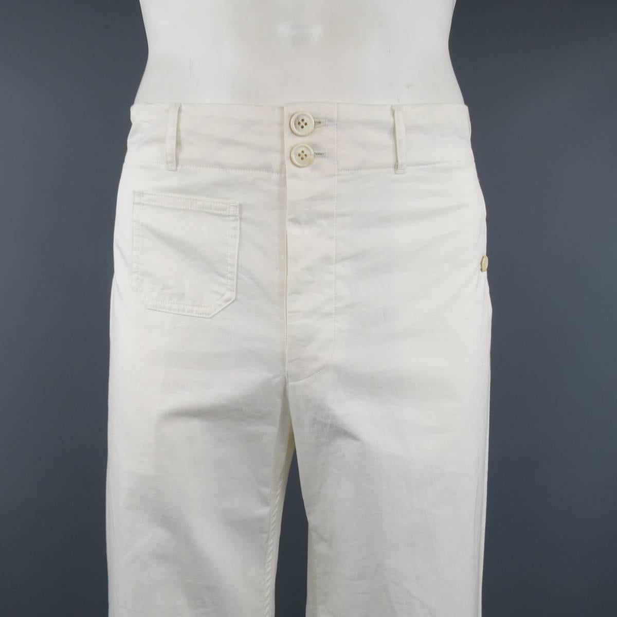 JUNYA WATANABE MAN cargo pants come in a light weight cream twill and feature a wide, straight leg, buttoned slit pockets, patch pocket, and adjustable side tabs. Minor Wear.
 
Good Pre-Owned Condition.
Marked: L
 
Measurements:
 
Waist: 37