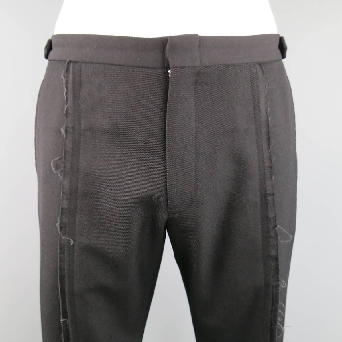 COMMES des GARCONS HOMME PLUS pants come in a medium weight black wool twill and feature a raw, frayed front eg seam. Have been let out and side tabs are not stitched down. As-Is. Made in Italy.
 
Good Pre-Owned Condition.
Marked: L AD2002
