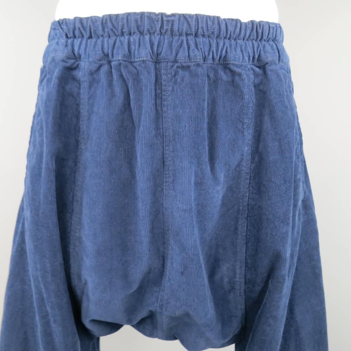 COMME des GARCONS SHIRT cropped trousers come in navy blue cotton corduroy and feature an elastic waistband, drop crotch panel, and back patch pockets.  Made in France.
 
Good Pre-Owned Condition.
Marked: M
 
Measurements:
 
Waist: 28 in.
Rise:19.5