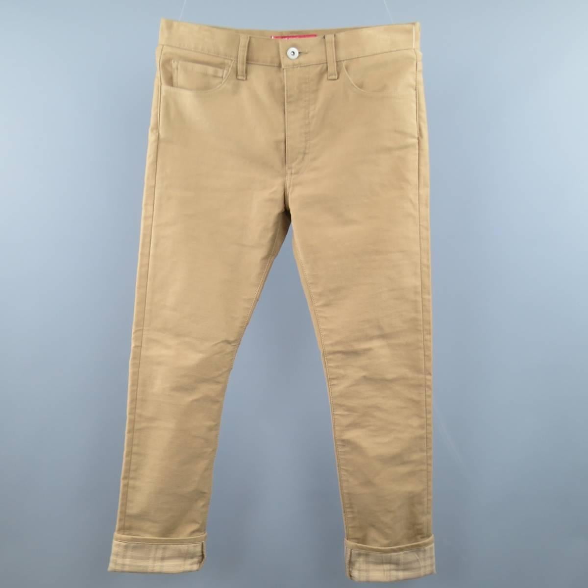 JUNYA WATANABE x LEVI'S jeans come in a tan jeans come in a classic cut and feature a plaid cuff lining, and brown leather pockets. Made in Japan.
 
New with Tags.
Marked: 510 32 32
 
Measurements:
 
Waist: 33 in.
Rise: 10.5 in.
Inseam: 30 in.


Web