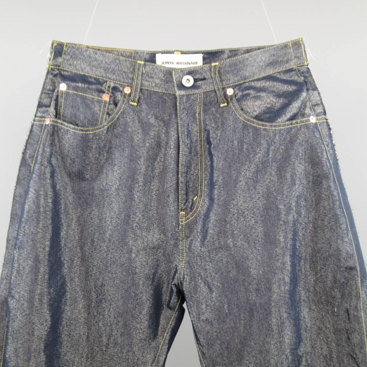 JUNYA WATANABE COMMES des GARCONS DENIM brand jeans come in a metallic sparkle foil blend denim and features a classic high rise denim cut and features a frayed hem and reverse side seam. Made in Japan.
 
Excellent Pre-Owned Condition.
Marked:
