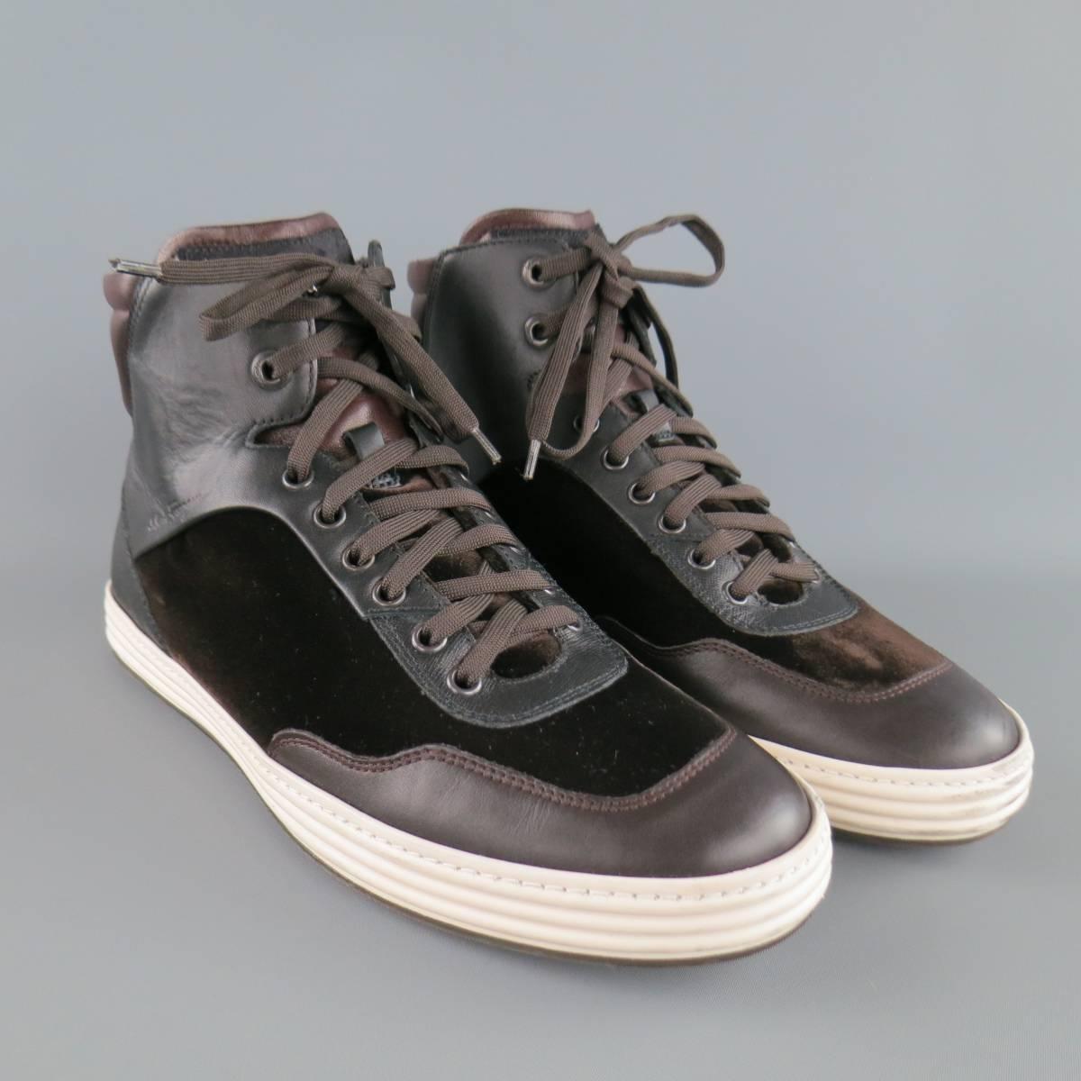 SALVATORE FERRAGAMO high top sneakers come in chocolate brown leather and features black leather  and velvet panels with a white sole. Made in Italy.
 
Excellent Pre-Owned Condition.
Marked: 8.5 D
 
Outsole: 11.5 x 4 in.
Height: 5 in.


Web ID: