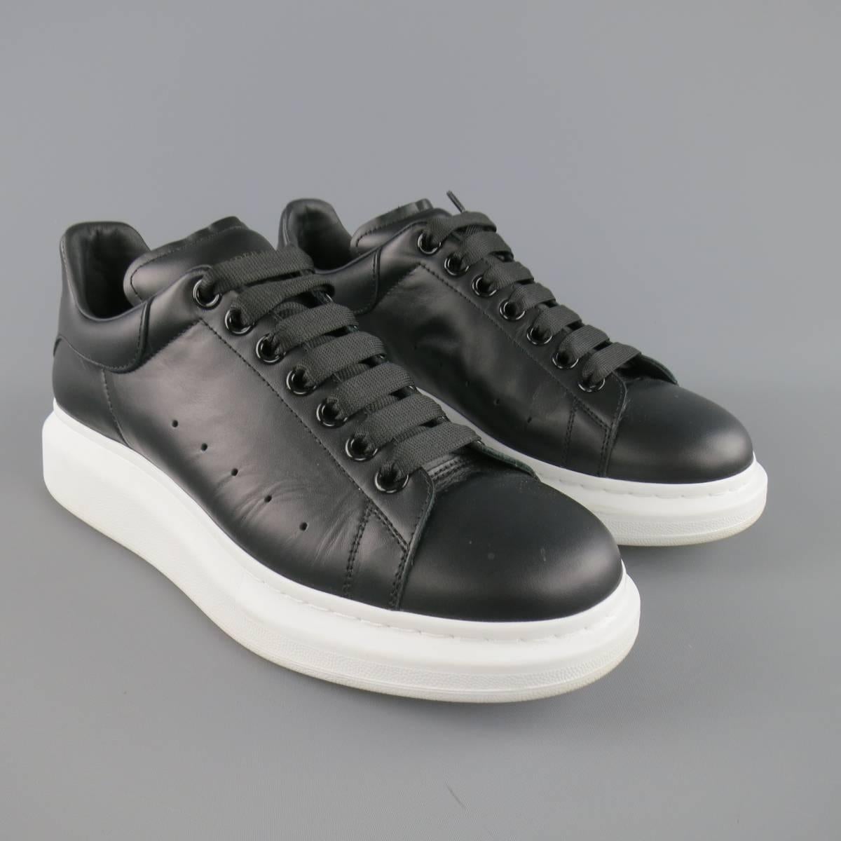 ALEXANDER MCQUEEN lace up sneakers come in a smooth matte black leather and feature oversized black grommets, a round toe, and oversized chunky white platform sole. With box. Made in Italy.
 
Excellent Pre-Owned Condition.
Marked: 42
 
Outsole: 12 x