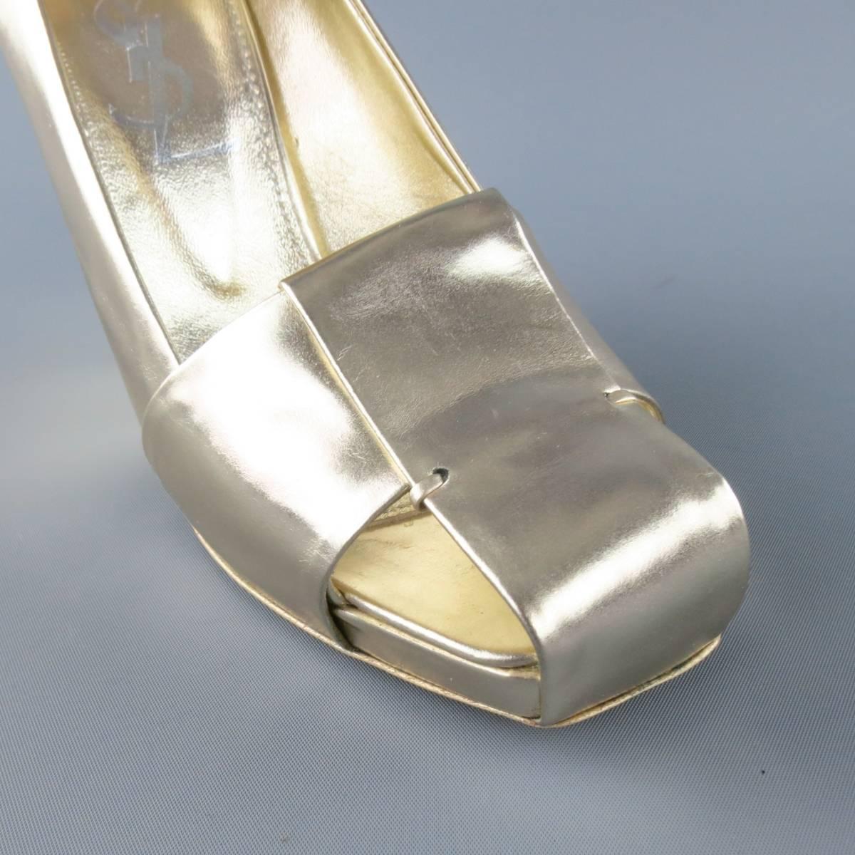 YVES SAINT LAURENT pumps come in a light metallic gold leather and feature a squared toe with cutouts, concealed platform, and thick, angular covered heel. Made in Italy.
 
Excellent Pre-Owned Condition.
Marked: 37.5
 
Heel: 4.5 in.
Platform:  0.5