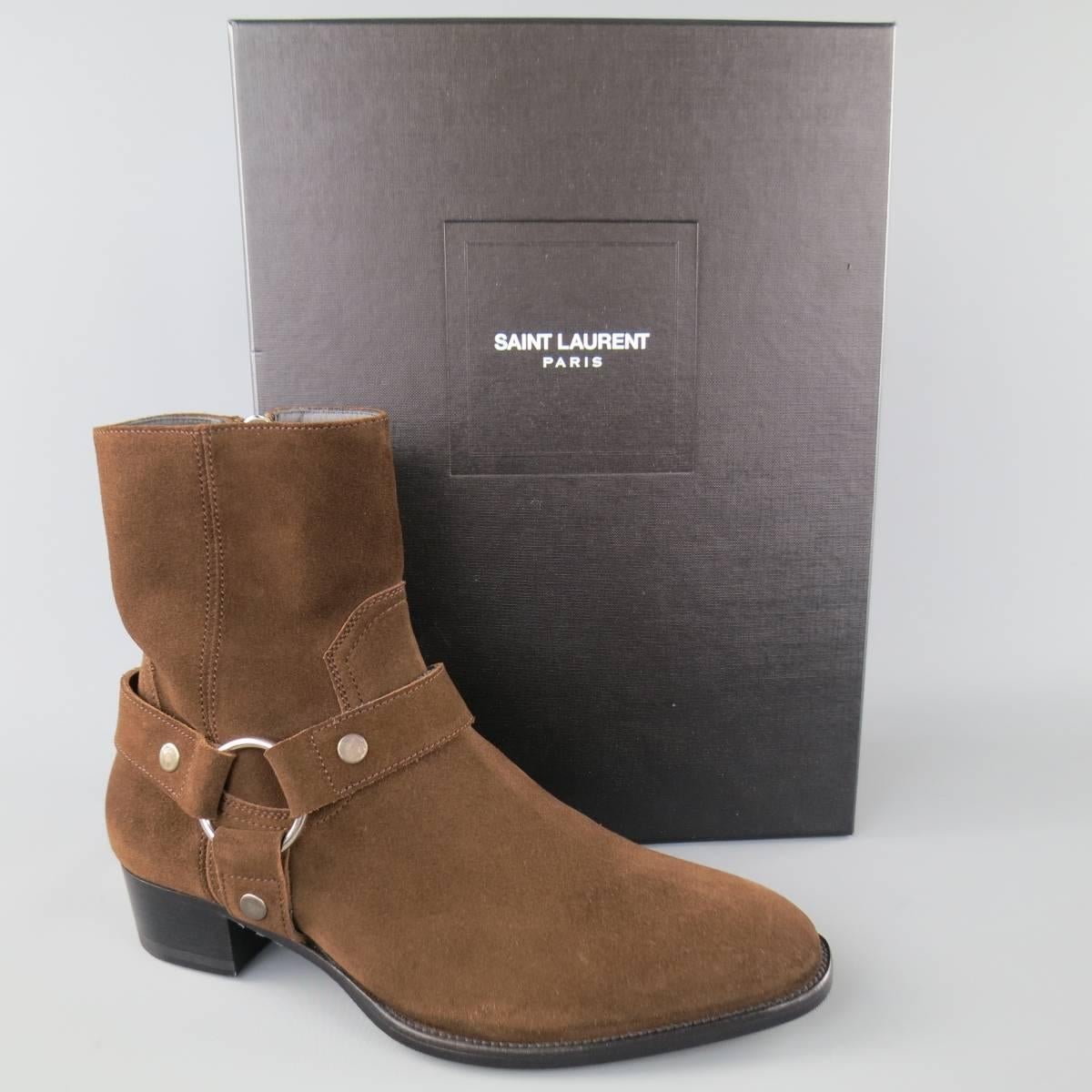 SAINT LAURENT "Wyatt" ankle boots come in a rich brown suede and feature a rounded point toe, ankle harness and black sole with heel. "Otterproof" Color:"Coffy" Made in Italy.
 
New in Box.
Marked: 39
 
Heel: 1.45