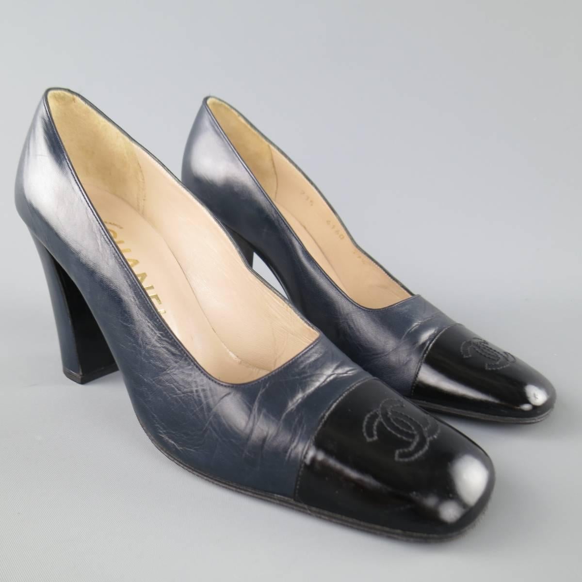 Vintage CHANEL pumps come in navy blue leather and feature a square cap toe with embroidered CC logo and thick covered heel. Made in France.
 
Good Pre-Owned Condition.
Marked: 37.5
 
Heel: 3.5 in.


Web ID: 82791 