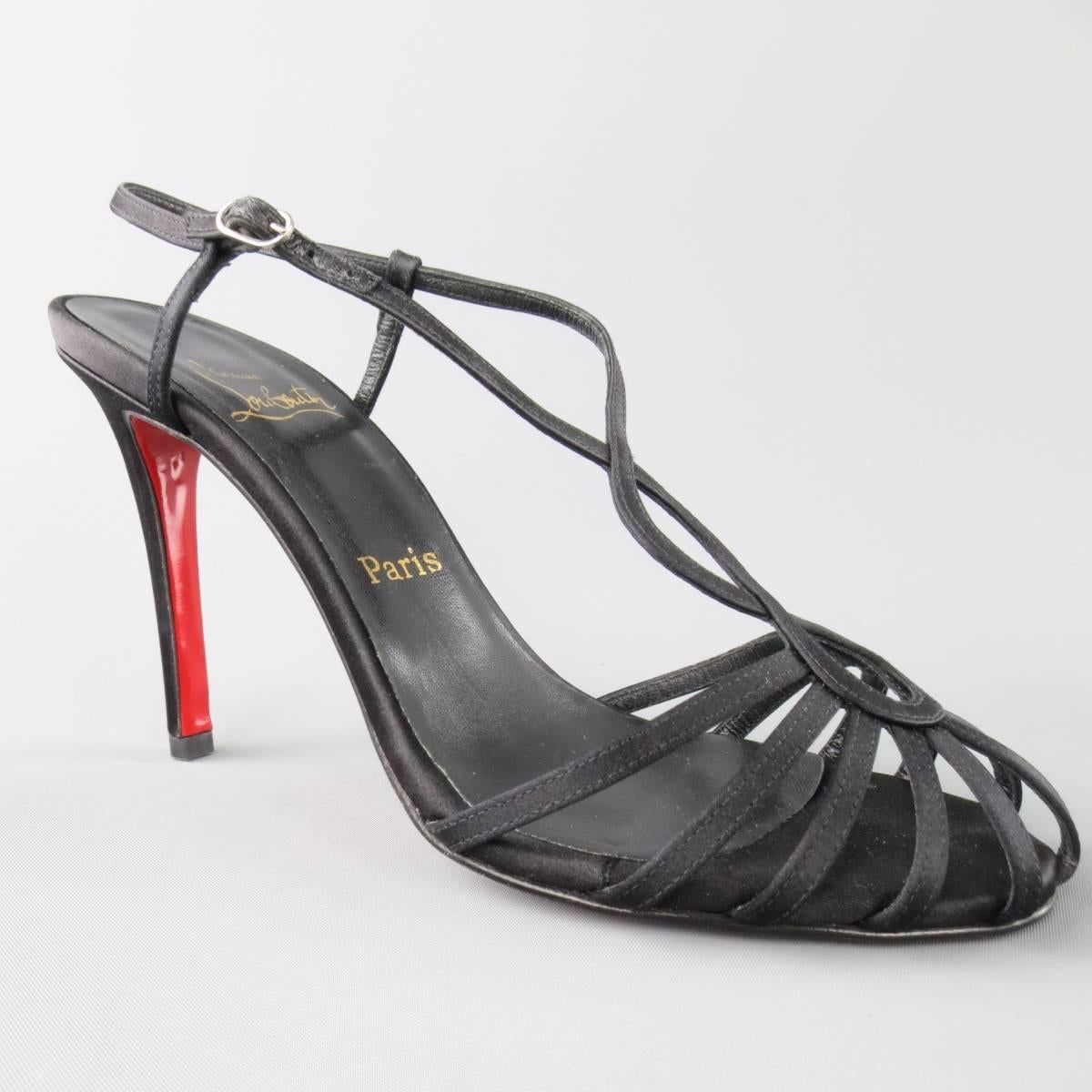 CHRISTIAN LOUBOUTIN sandals come in a black silk satin and feature a strappy toe box and curved T ankle strap. Never worn, only tried on. Made in Italy.
 
New in Box.
Marked: 38.5
 
Heel: 4.5 in.


Web ID: 82780 