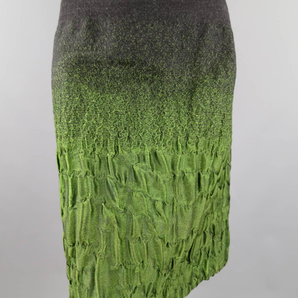 This fabulous PRADA Fall/Winter 2007 Collection skirt comes in a charcoal and green textured gradient wool blend fabric with a slim A-line silhouette and side zip closure. Very minor discoloration shown in detail shot. Featured in ad campaign. Made