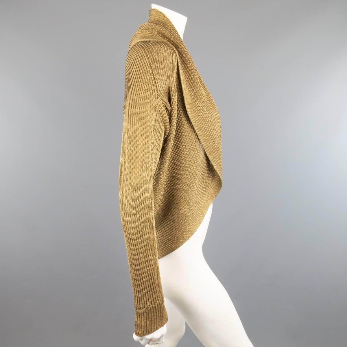 RALPH LAUREN BLACK LABEL cardigan comes in a metallic gold silk blend sparkle knit and features an oversized draped shawl collar and open front. Minor wear throughout.
 
Good Pre-Owned Condition.
Marked: L
 
Measurements:
 
Shoulder: 17 in.
Bust: 42