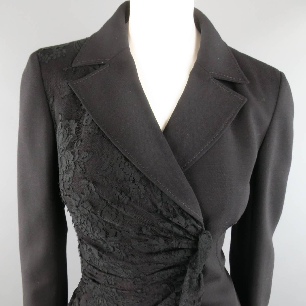 Gorgeous VALENTINO blazer jacket in black wool fabric featuring a classic pointed collar, fitted, cropped silhouette, half draped lace overlay with double breasted, wrap closure, and lace trim cuffs. Minor wear. Made in Italy.
 
Good Pre-Owned