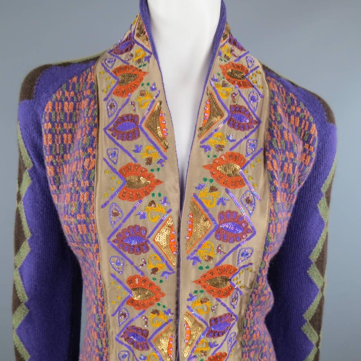 Open front ETRO cardigan features a purple, orange, and green pattern knit body, beige satin trim collar with sequin embroidery, and argyle pattern sleeves. Made in Italy.
 
Good Pre-Owned Condition.
Marked: 46
 
Measurements:
 
Shoulder: 17