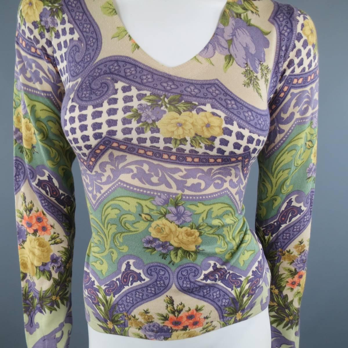 ETRO V neck pullover sweater comes in a light weight beige silk cashmere knit with allover purple and green abstract brocade floral  and paisley print. Care tag removed. Small hole in shoulder. Made in Italy.
 
Fair Pre-Owned Condition.
Marked: 42
