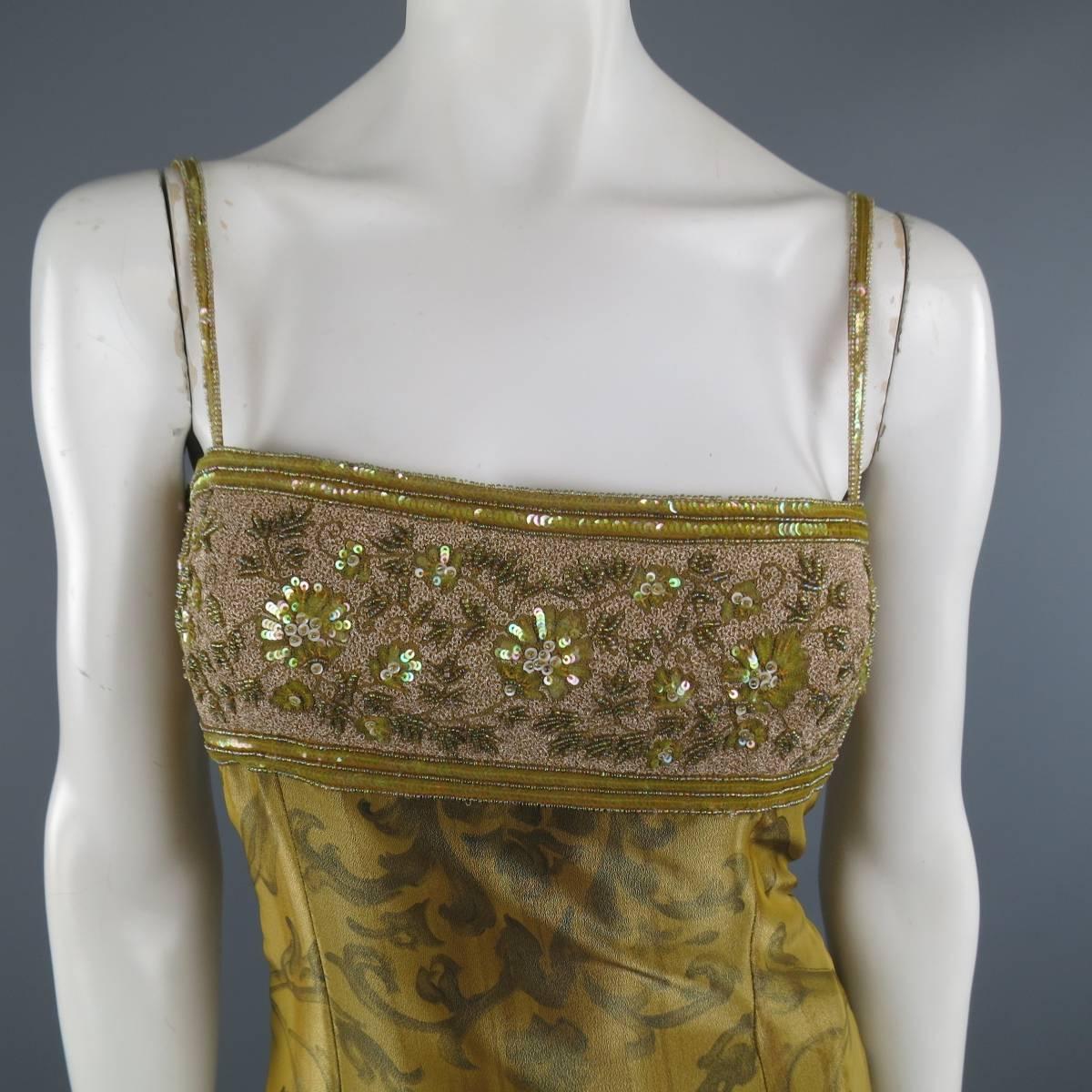 Vintage ESCADA COUTURE cocktail dress comes in a metallic brocade print silk blend material and features a thick sequin floral bust line and skinny sequin straps. Runs very small. See measurements. Made in Germany.
 
Excellent Pre-Owned