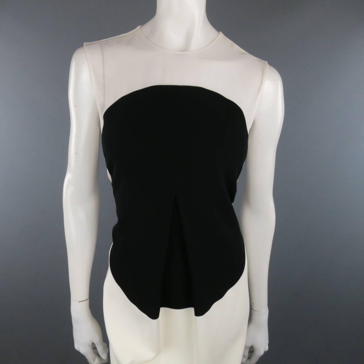 CALVIN KLEIN COLLECTION sleeveless shift dress comes in a cream fabric and features a sheer front panel, black circle panel, box pleated front. Made in Italy.
 
New with Tags.
Marked: 6/42
 
Measurements:
 
Shoulder: 15 in.
Bust: 35 in.
Waist: 32