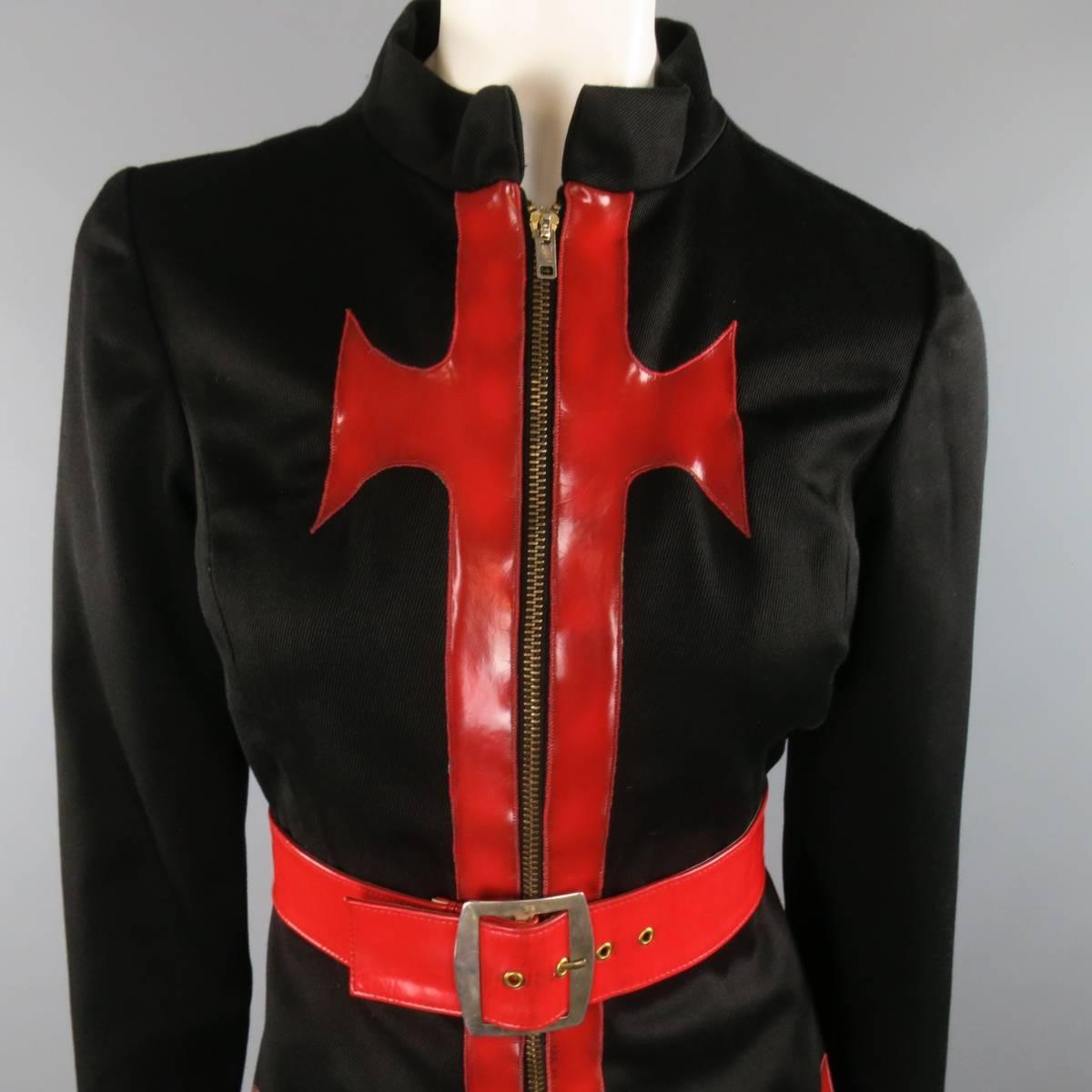 Rare 1970's vintage OSCAR DE LA RENTA BOUTIQUE label coat comes in a heavy black wtill and features a band collar, zip closure front, and red patent leather Gothic cross details. Wear and discolorations throughout patent details and belt.  As-Is.
