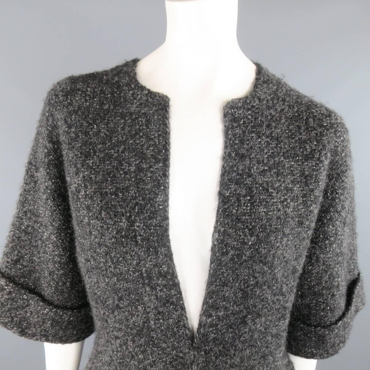 RALPH LAUREN BLACK LABEL cardigan coat comes in a sparkly, metallic, wool, cashmere Hetaher boucle knit and features a round neckline, open front, slit pockets, and three quarter cuffed sleeves.
 
Excellent Pre-Owned Condition.
Marked: S
