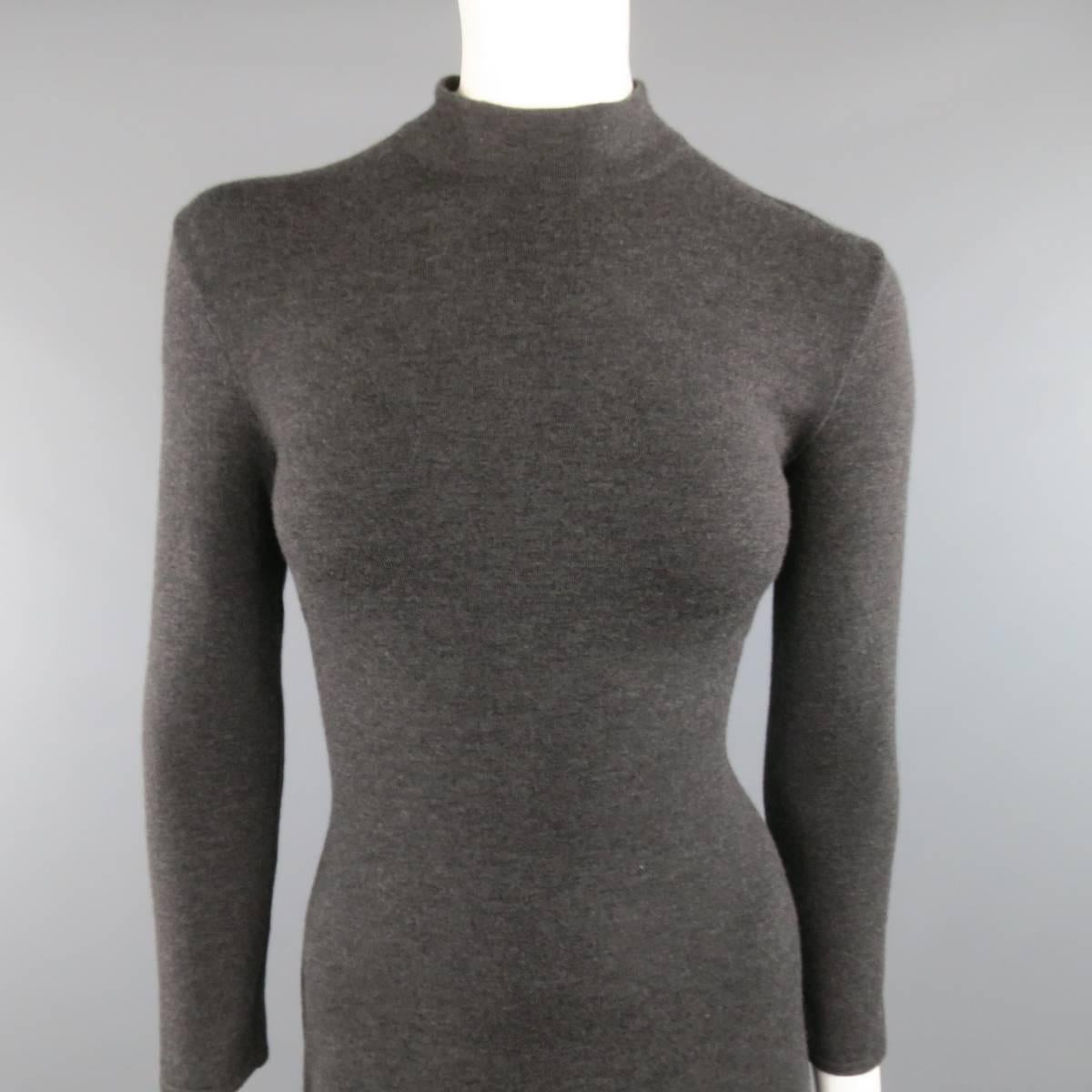 RALPH LAUREN COLLECTION fitted sweater dress comes in a charcoal gray stretch cashmere knit and features a mock turtleneck and long sleeves.
 
Excellent Pre-Owned Condition.
Marked: M
 
Measurements:
 
Shoulder: 6 in.
Bust: 32 in.
Waist: 28 in.
Hip: