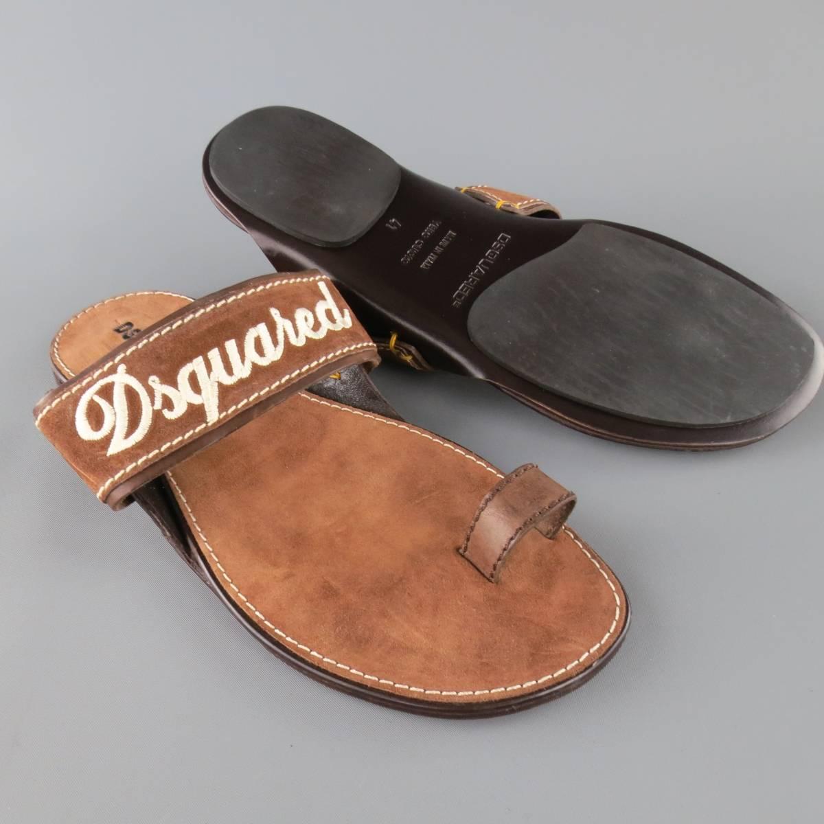 DSQUARED2 sandals feature a thick tan brown suede strap with cream embroidered logo and leather toe strap. Made in Italy.
 
Excellent Pre-Owned Condition.
Marked: 41


Web ID: 83156 