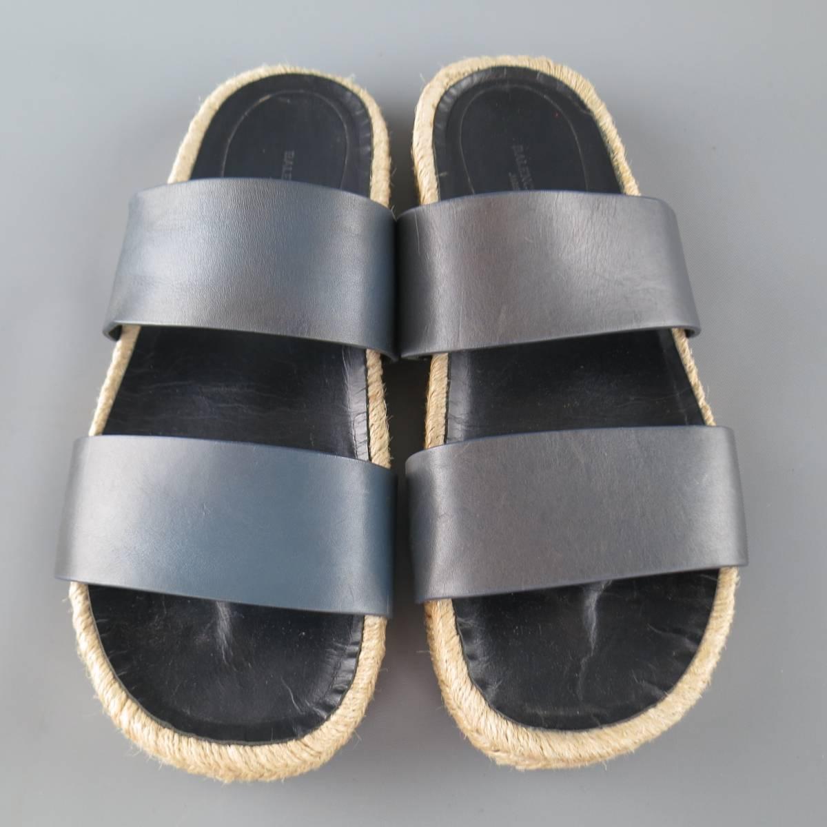 BALENCIAGA slide sandals feature double thick navy leather straps with a woven espadrille sole. Slight color variations throughout leather. Made in Spain.
 
Good Pre-Owned Condition.
Marked: 40


Web ID: 75928 