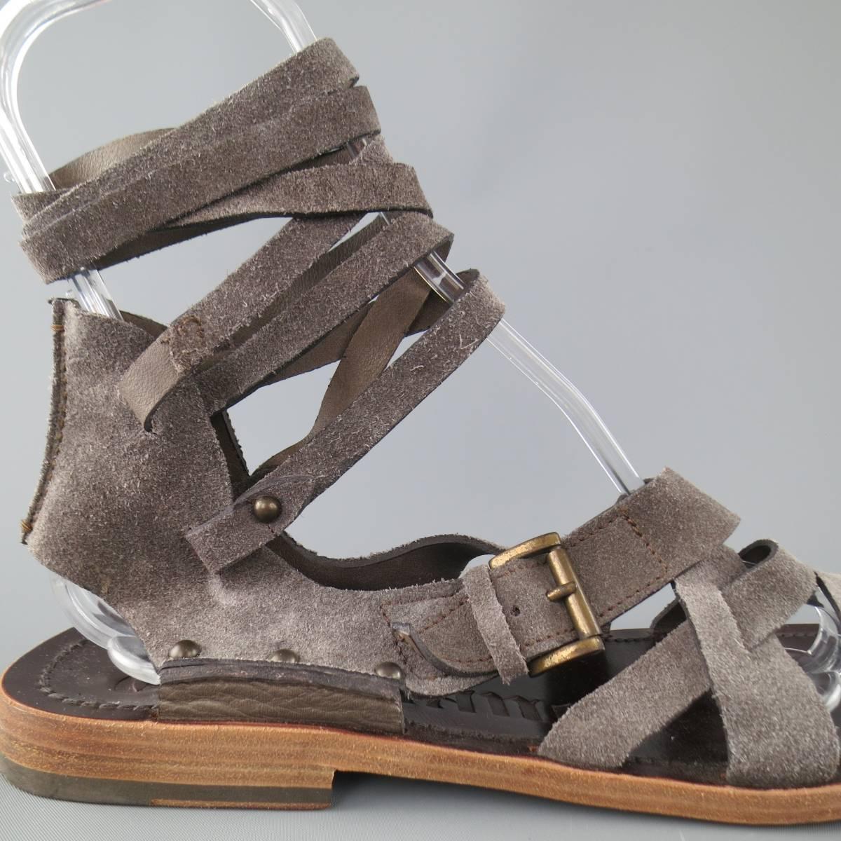 JOHN GALLIANO gladiator sandals feature light gray strappy front with a long wrapped ankle strap. Made in Italy.
 
Good Pre-Owned Condition.
Marked: 42


Web ID: 77989 
