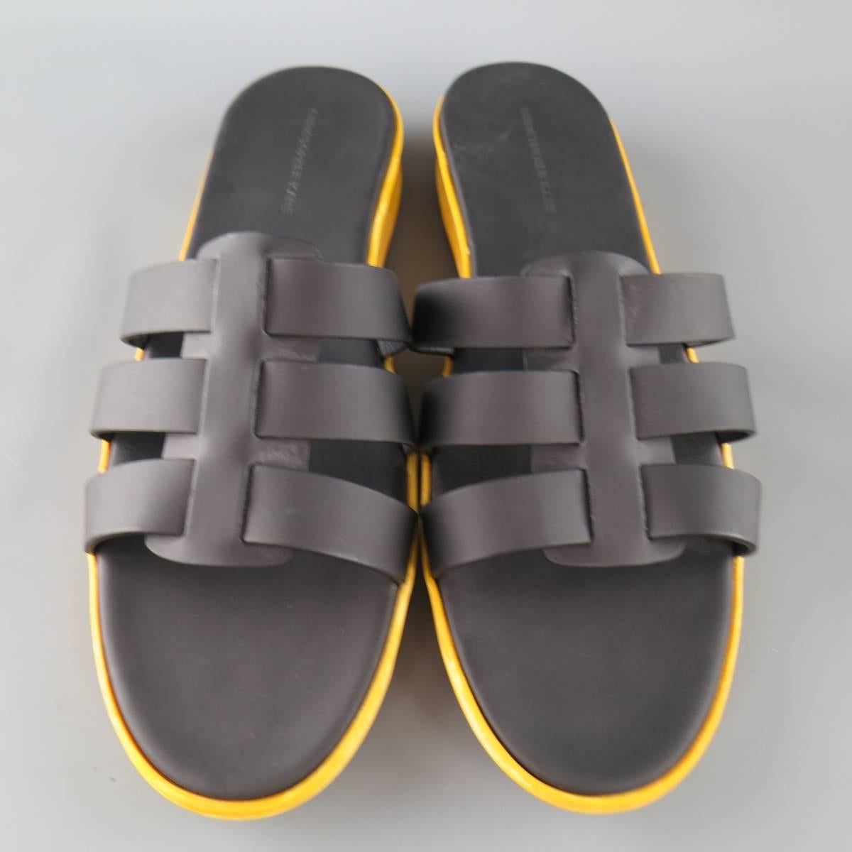 CHRISTOPHER KANE sandals feature black rubberized leather straps and a thick textured yellow rubber sole. Made in Italy.
 
Excellent Pre-Owned Condition.
Marked: (no Size)
 
Outsole: 11.75 x 3.95 in.


Web ID: 82288 
