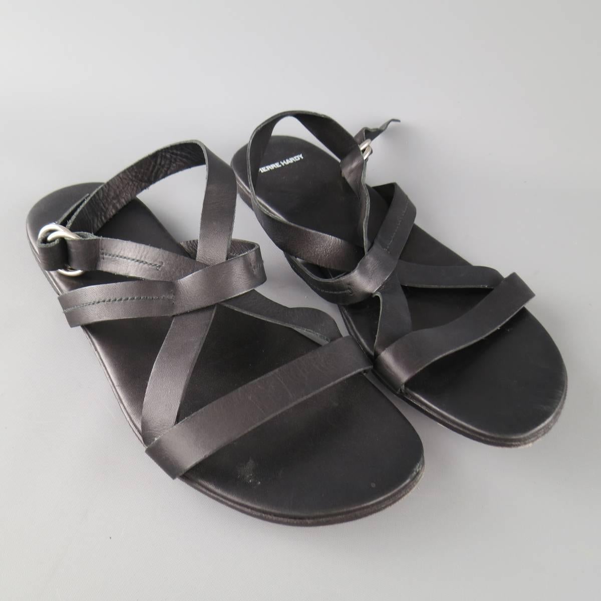 PIERRE HARDY sandals come in black leather and feature crossed ankle and toe strap. Made in Spain.
 
Good Pre-Owned Condition.
Marked: 44


Web ID: 77990 
