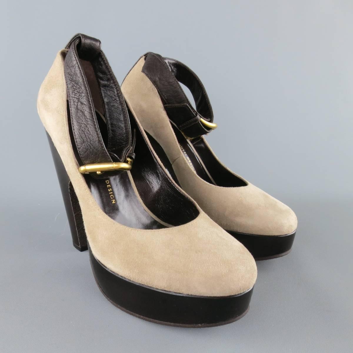 GIUSEPPE ZANOTTI pumps come in light taupe gray suede and feature a round toe, brown leather ankle strap with gold tone buckle, and thick, retro style platform sole. Made in Italy.
 
Excellent Pre-Owned Condition. Retails at $720.00.
Marked: IT 39
