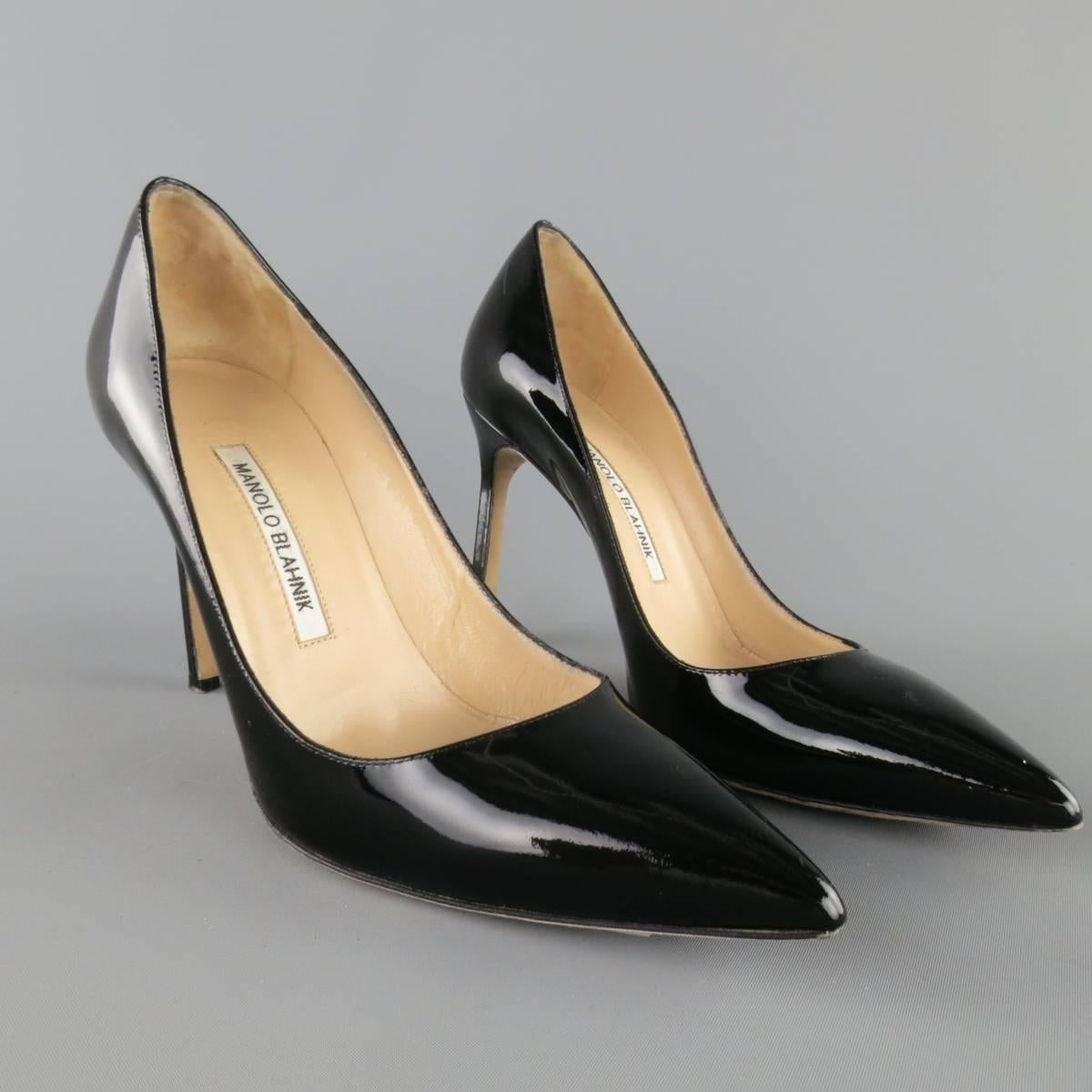 Classic MANOLO BLAHNIK pump in high gloss black patent leather with a pointed toe and covered stiletto heel. Hand made in Italy.
 
Excellent Pre-Owned Condition.
Marked: IT 37.5
 
Heel: 4 in.


Web ID: 83521 